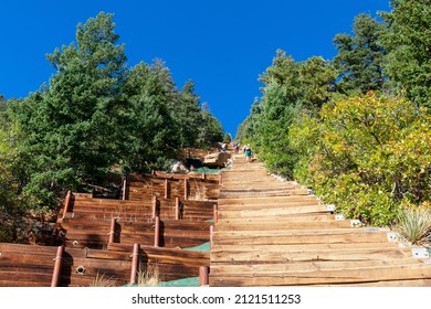 Wooden steps leading up to the top of Manitou Incline. Manitou Springs Incline is a popular hiking trail rising above Manitou Springs, Colorado - Shutterstock ID 2121511253