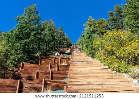 Wooden steps leading up to the top of Manitou Incline. Manitou Springs Incline is a popular hiking trail rising above Manitou Springs, Colorado