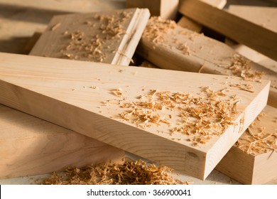 Wooden Sticks Lie On A Workbench In The Carpentry Workshop