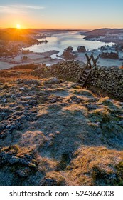 Wooden Stile With View Of Windermere In The Lake District On A Frosty Autumn Morning.