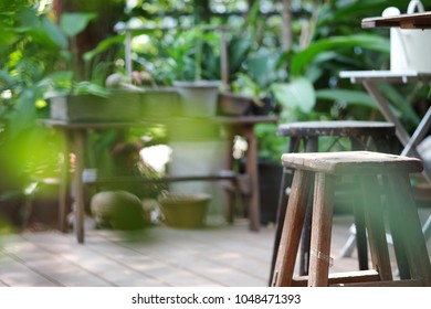 Wooden Stool In Green Garden