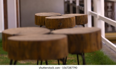 Wooden Stool Top On Metal Legs With Blurred Forground