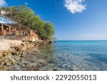 A wooden structure, overlooking the clear, Caribbean ocean, at Kokomo Beach, Curacao, Dutch Antilles