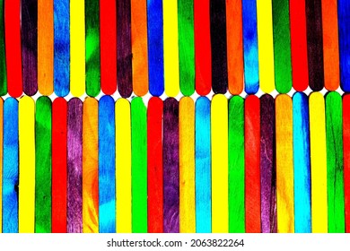 Wooden Sucker Stick Background Dyed With Food Colouring Highlighting Textures And Patterns 

