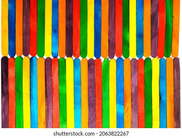 Wooden Sucker Stick Background Dyed With Food Colouring Highlighting Textures And Patterns 

