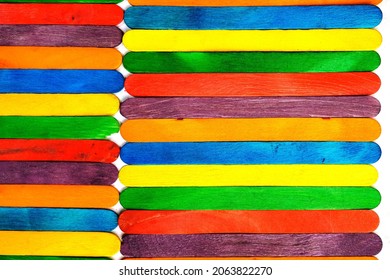 Wooden Sucker Stick Background Dyed With Food Colouring Highlighting Textures And Patterns 

