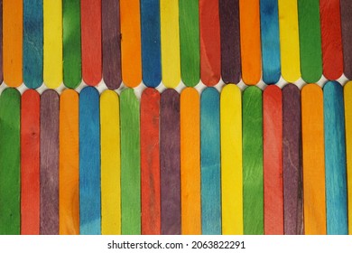 Wooden Sucker Stick Background Dyed With Food Colouring Highlighting Textures And Patterns 

