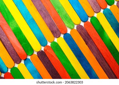 Wooden Sucker Stick Background Dyed With Food Colouring Highlighting Textures And Patterns 

