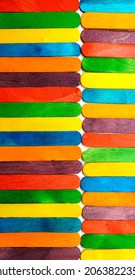 Wooden Sucker Stick Background Dyed With Food Colouring Highlighting Textures And Patterns 

