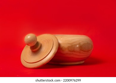 Wooden Sugar Bowl On A Red Background.