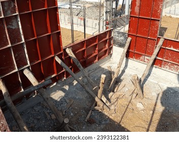 Wooden supports, steel sheets, ready to pour cement on the wall - Powered by Shutterstock