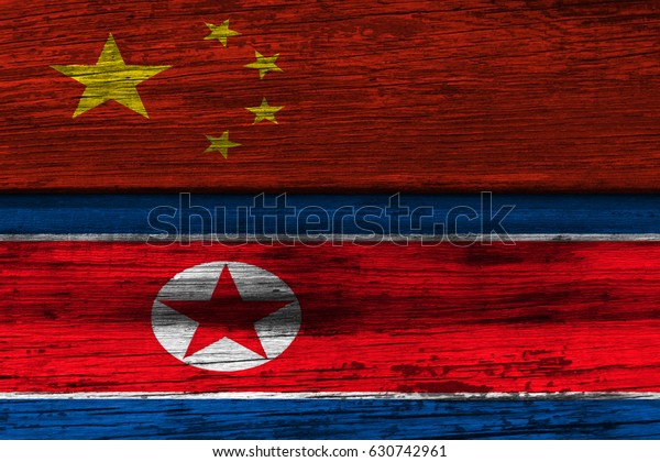 The wooden\
surface. Flags: North Korea,\
China
