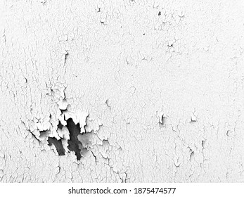 Wooden surface painted with white paint with shabby peels and cracks, falling off. Abstract grey and white background for text, wallpaper or construction work or repair and renovation services.