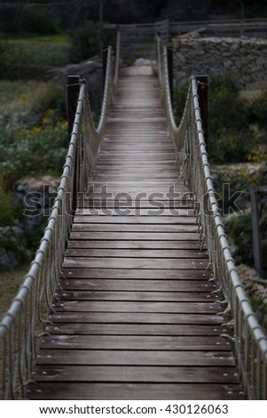 Similar – Image, Stock Photo Little girl jumping on a path of wooden boards in a wetland