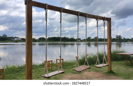 Wooden Swing Set By The River.