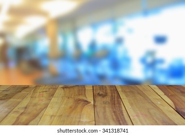 Wooden Table And Abstract Blur Photo Modern Fitness Center Background