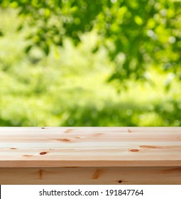 Wooden Table For Background Against Defocused Garden