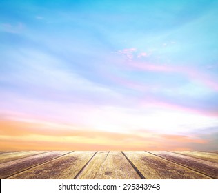 Wooden table with beauty dramatic sky sunrise background