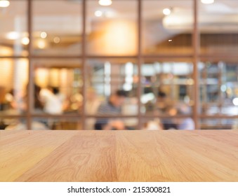 Wooden Table And Blur Restaurant Background