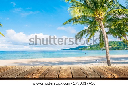 Wooden table/ board mockup with sea, beach, coconut tree background