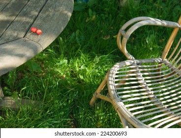 Wooden Table And Chair, Two Cherries On Edge Of Table