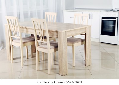 Wooden Table And Chairs In The Kitchen