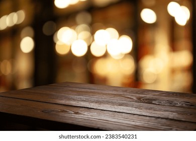 wooden table close up with cafe background blur, for photo montage or product display, space to place items on the table. - Powered by Shutterstock