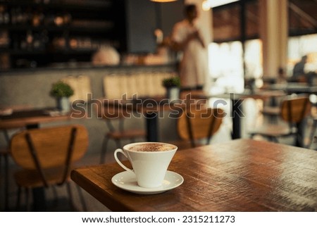 Wooden table, coffee shop mug and cafe store, restaurant or diner for commerce beverage, drink or retail shopping service. Tea cup, morning espresso or startup small business for fresh caffeine sales