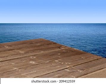 Wooden table corner with seascape background