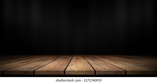 Wooden Table With Dark Blurred Background.