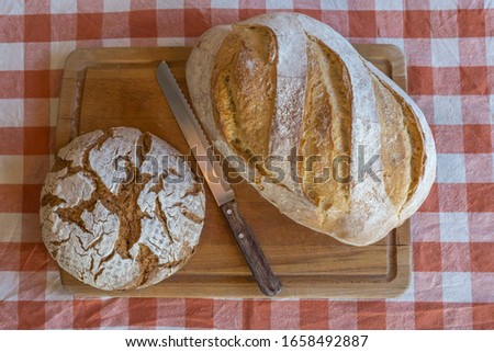 Wooden table with different kinds of bread