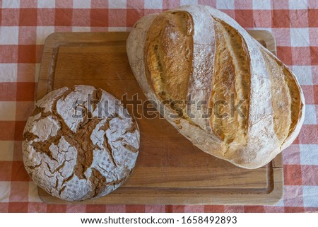 Wooden table with different kinds of bread