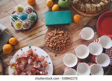 Wooden Table With Different Type Of Snacks Preparing For Party.