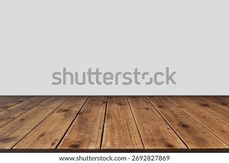 Wooden table with empty gray background, ideal for product presentation, banner design, or advertising mockup. Clean composition and natural texture create a modern minimalist display scene.