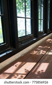 wooden table empty space for your work with light shadow from window
