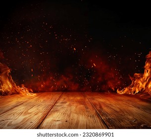 wooden table with Fire burning at the edge of the table, fire particles, sparks, and smoke in the air, with fire flames on a dark background to display products	