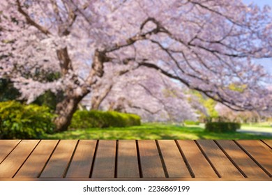 wooden table with flowers bokeh background - Powered by Shutterstock