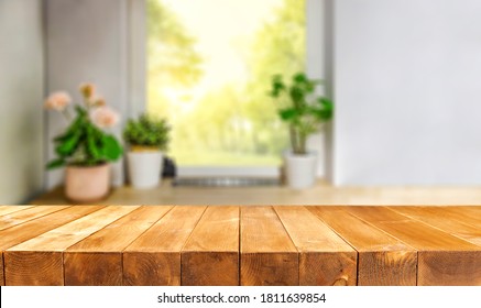 Wooden Table Of Free Space And Window Background With Flowers 