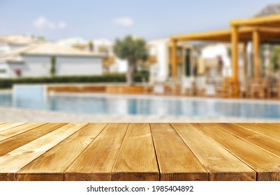 Wooden Table Of Free Space For Your Decoration And Summer Swimming Pool Background. 