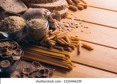 Wooden table full of fiber-rich whole foods, perfect for a balanced diet - Powered by Shutterstock