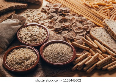 Wooden table full of fiber-rich whole foods, perfect for a balanced diet - Powered by Shutterstock