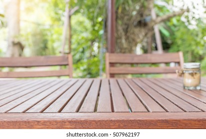 wooden table in garden with space for your photo  - Shutterstock ID 507962197