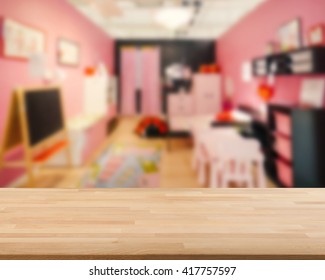 Wooden Table With Kids Room Blurred Background