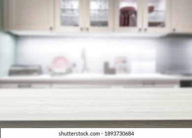 A Wooden Table In The Kitchen Surrounded By A Nice Family Atmosphere