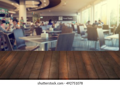 Wooden Table, Mock Up Interior Restaurant Design, Advertising Food Court With Wooden Table Texture Background, Empty Table Ready For Product Display Montage Over Blurred Food Court Background.