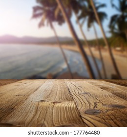 Wooden Table On The Beach With Palms