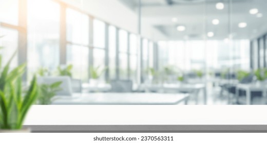 wooden table on Blurred empty open space office. Abstract light bokeh at office interior background for design.