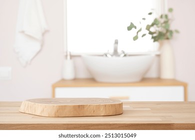 Wooden table with pedestal in blur bathroom for bathing and spa product display