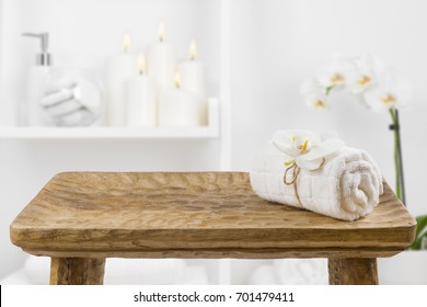 Wooden Table With Spa Towel On Blurred Bathroom Shelf Background