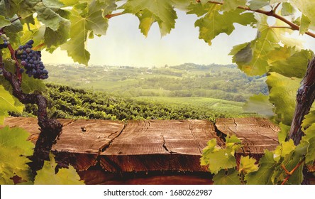 Wooden table. Spring design with vineyard and empty display. Space for your montage. Autumn grapes harvest - Shutterstock ID 1680262987
